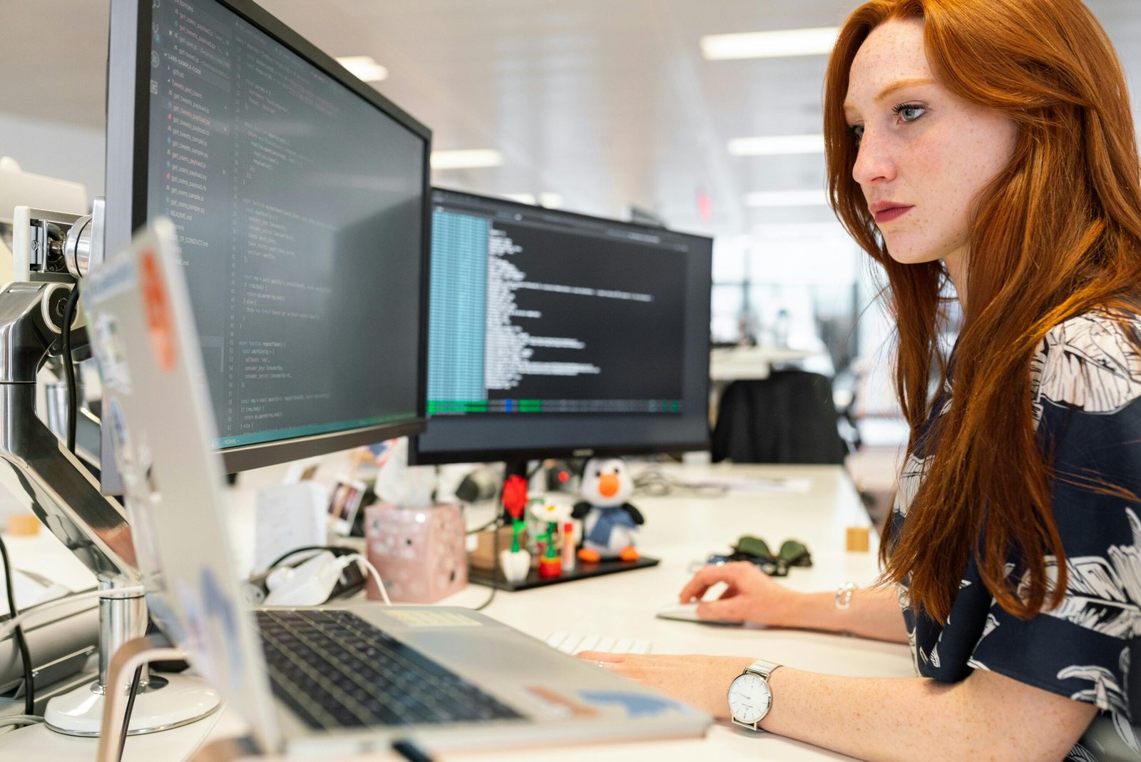 its a woman facing the computer